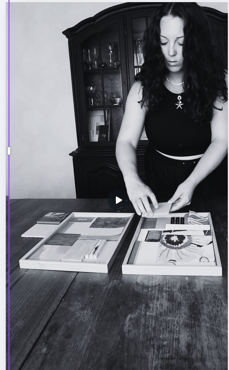 Camilla at a dining table laying out material sample boards